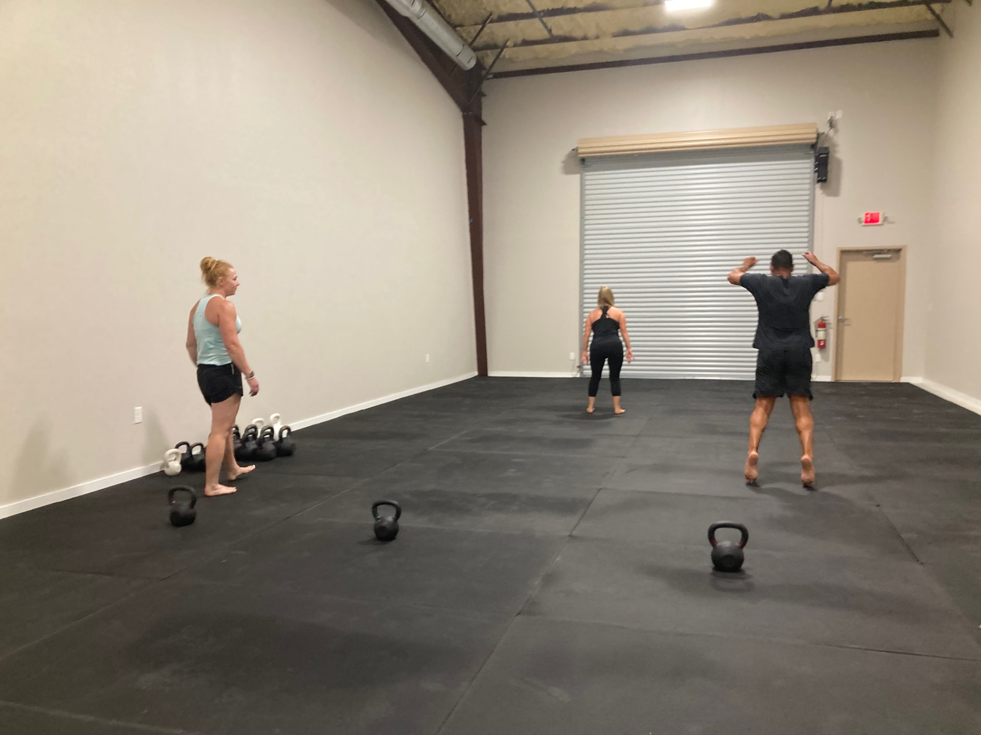 Small group class training on the open kettlebell floor at Liberty Bells